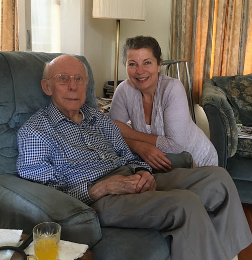 A photo of Jane Fletcher sitting with her father Both looking into the camera