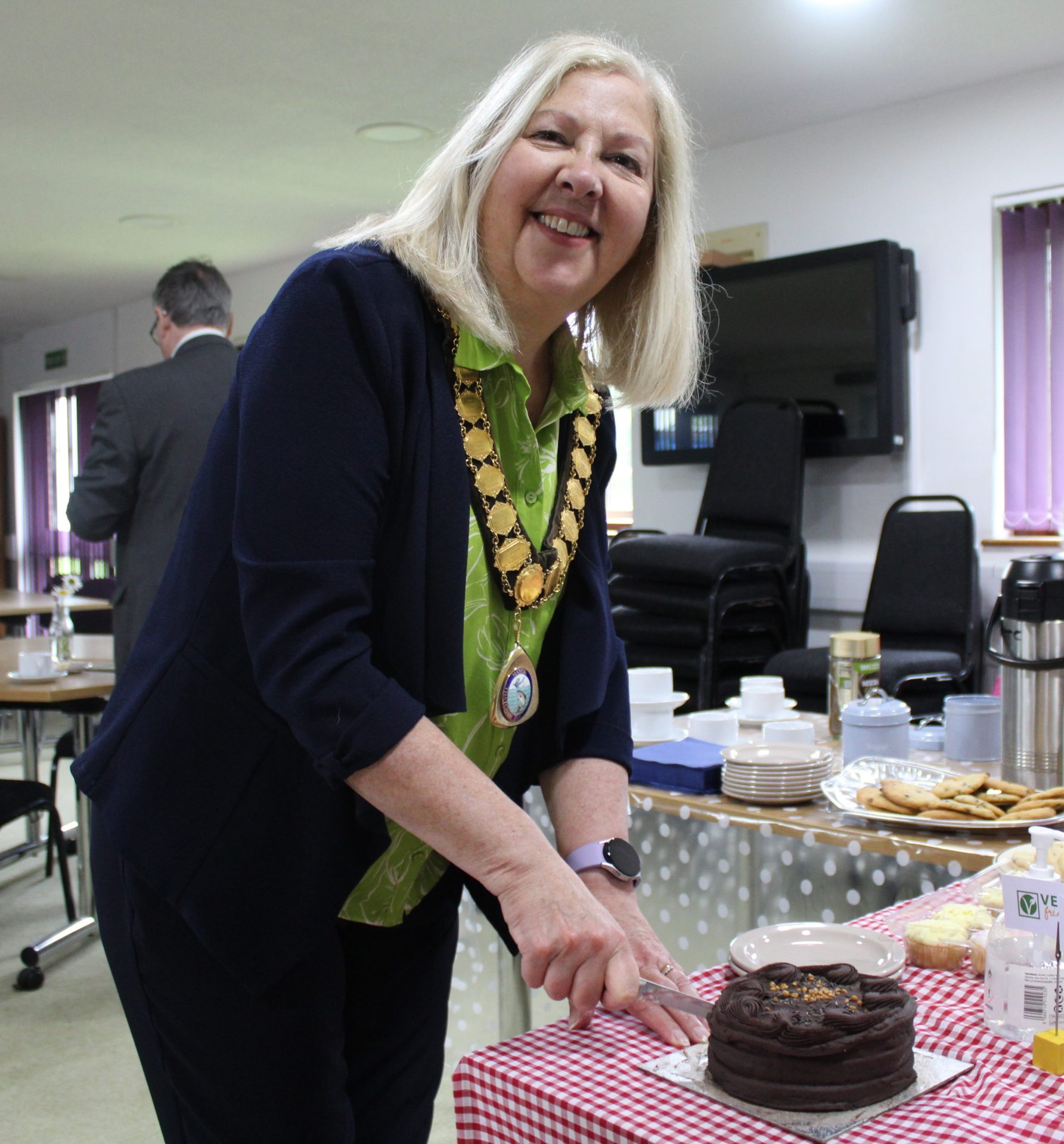 Cllr Suzanne Adamantos cutting the cake
