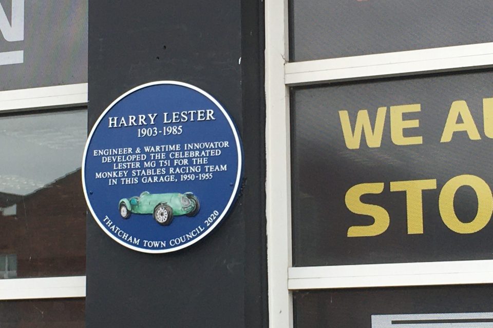 A photo of the blue plaque on the side of the garage on the Bath Road A4. It reads: Harry Lester. 1903 - 1985. Engineer and wartime innovator developed the celebrated Lester MGT51 for the Monkey Stables Racing team in this garage, 1950 - 1955.
